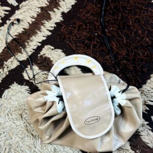 Beige drawstring cosmetic travel bag